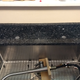 Yes, the faucet hole is off center, as requested.